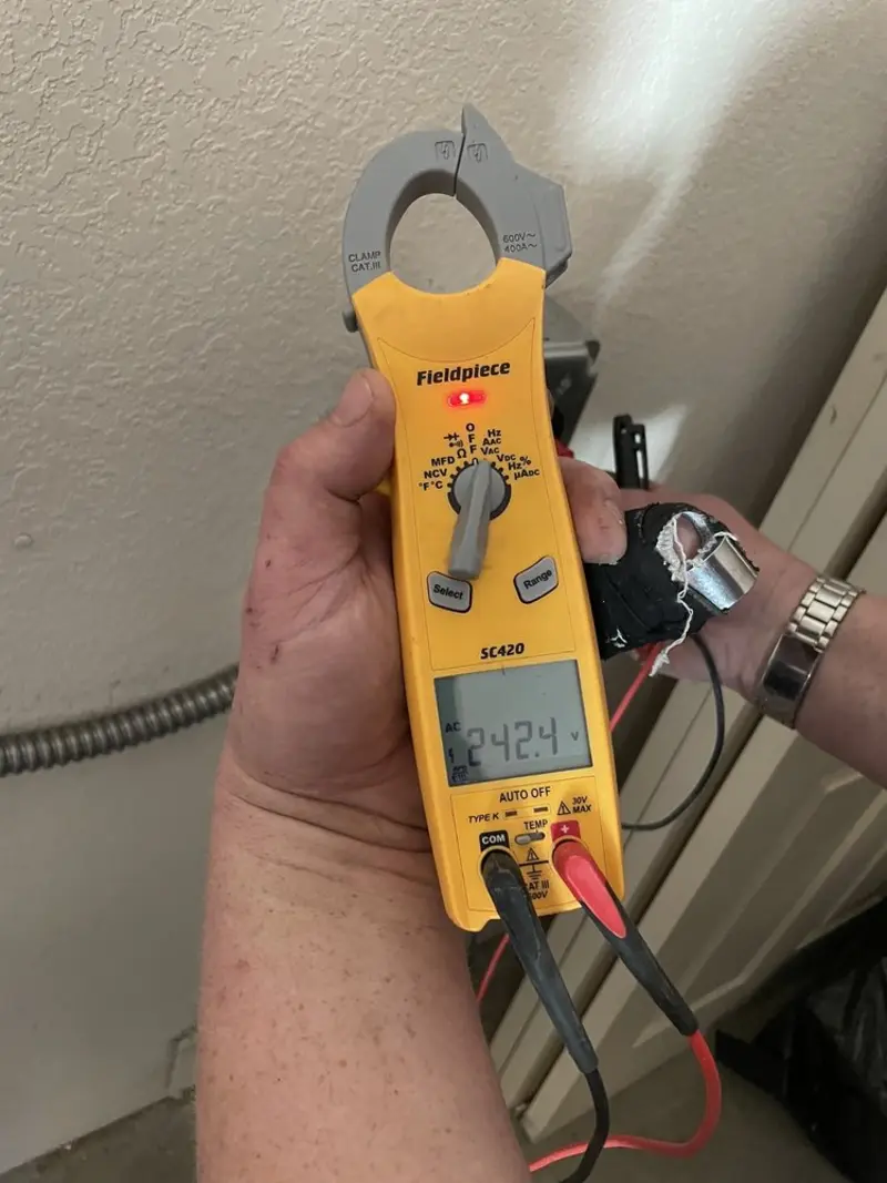 Voltage testing with clamp meter during Outlet Installation in Fairfield